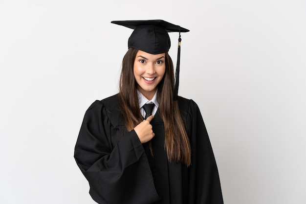 Teenager Brazilian university graduate over isolated white background with surprise facial expression