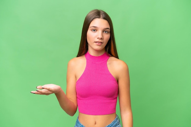 Teenager caucasian girl over isolated background making doubts gesture