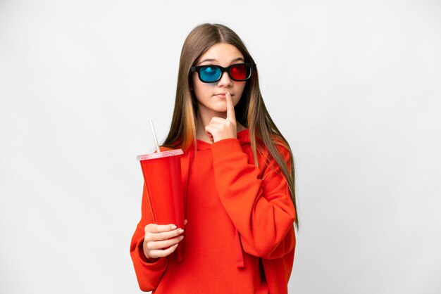 Teenager girl in a cinema over isolated white background having doubts while looking up