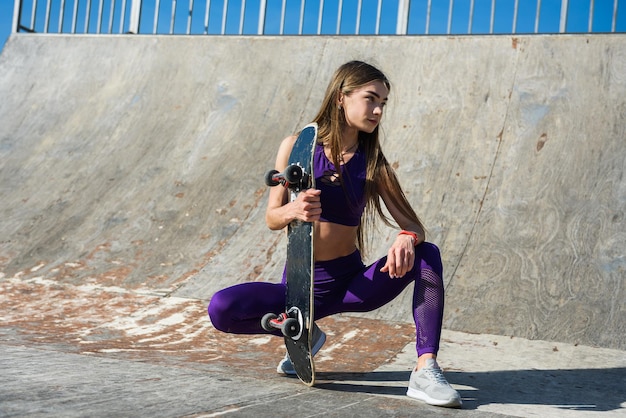 Teenager girl ride her skateboard.  Healthy lifestyle