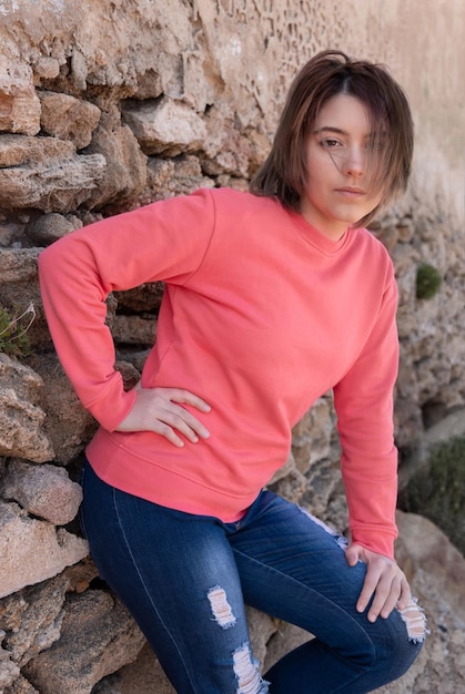 Teenager girl wearing pink long sleeve shirt standing outdoor mockup