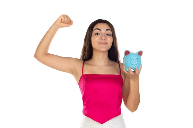 Teenager girl wearing pink top standing with piggy bank money box