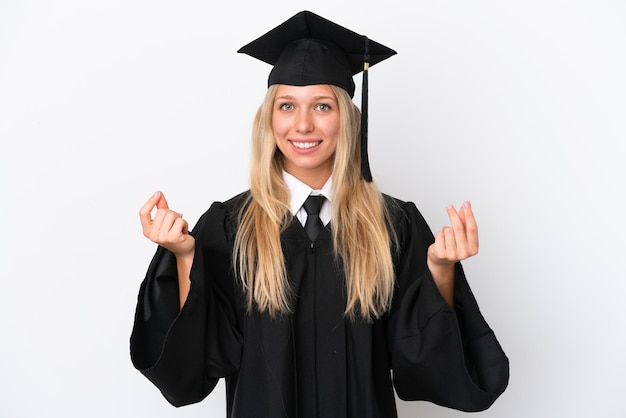 Teenager girl with braids over isolated pink background holding a megaphone and with surprise expression