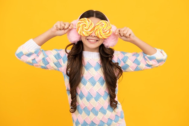 Teenager girl with caramel candies on sticks sweet sugar addiction Child with lollipops