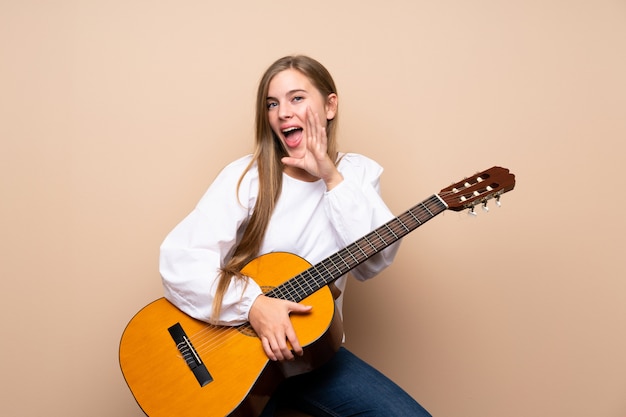 Teenager girl with guitar 