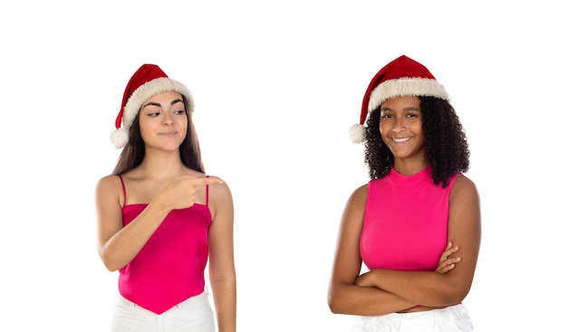 Teenager girls friend in Christmas hat isolated on white background