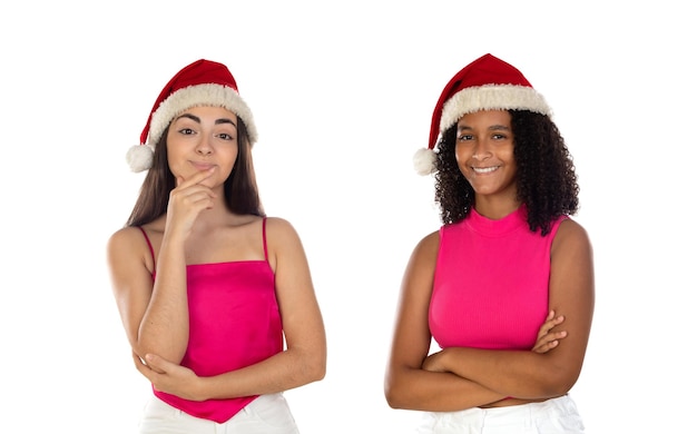 Teenager girls friend in Christmas hat isolated on white background