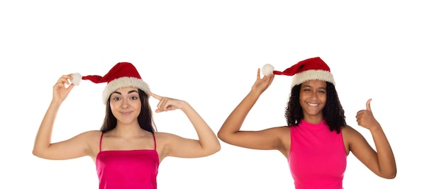 Teenager girls friend in Christmas hat isolated on white background