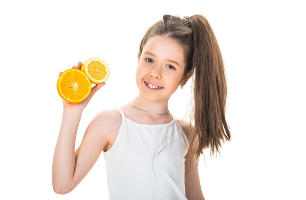 Teenager holding citrus orange fruit Beautiful little girl with oranges lemons grapefruits vitamin Baby girl holding a big juicy orange Little girl holding and eating lemons on white background