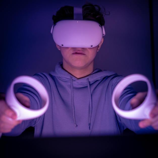 Teenager playing with virtual reality device immersive experience with video game and vr 3d viewer