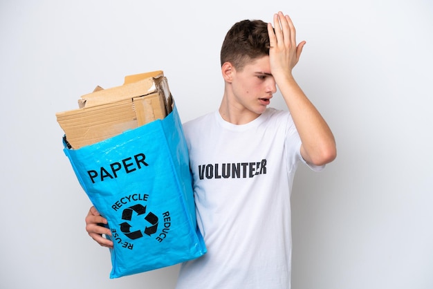 Teenager Russian man holding a recycling bag full of paper to recycle isolated on white background has realized something and intending the solution