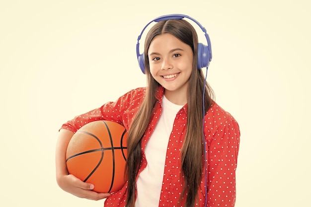 Teenager school girl with basketball ball Portrait of happy smiling teenage child girl Concept of kids sport active lifestyle health team game hobby