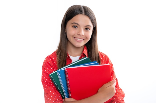 Teenager school girl with books isolated white studio background Portrait of happy smiling teenage child girl