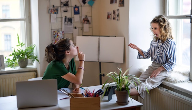 Teenager schoolgirl learning online indoors at home