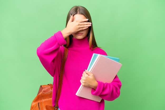 Teenager student caucasian girl over isolated background covering eyes by hands Do not want to see something