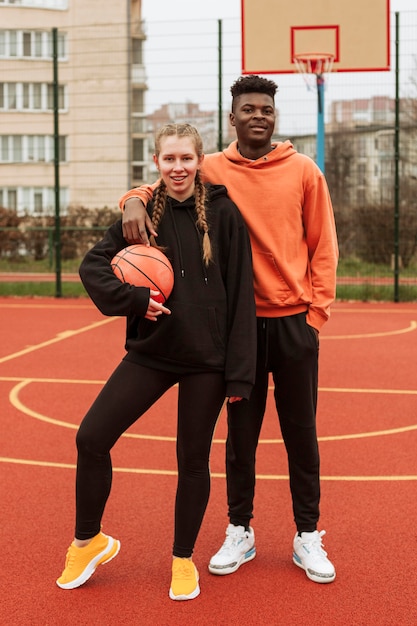 Teenagers at the basketball field together