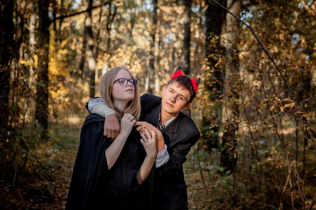 Teenagers in Halloween costumes in the woods