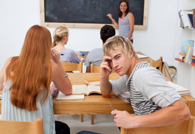 Teenagers studying together in a class