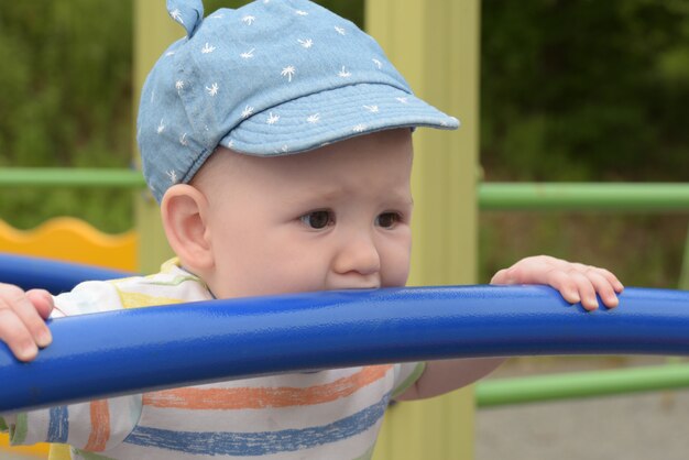 Teething Baby boy on the playground