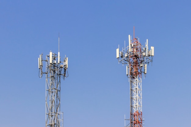 Telecommunication tower with blue sky and white clouds background,satellite pole communication technology.
