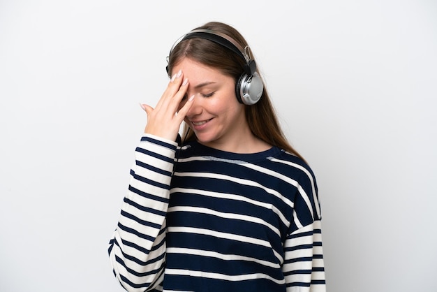 Telemarketer caucasian woman working with a headset isolated on white background laughing