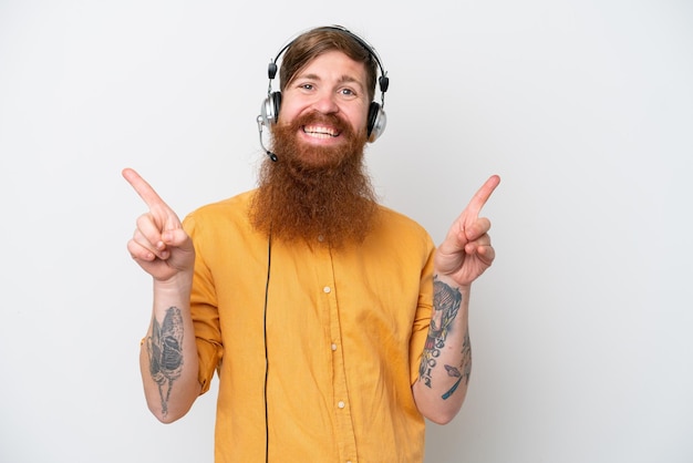 Telemarketer man isolated on white background pointing finger to the laterals and happy