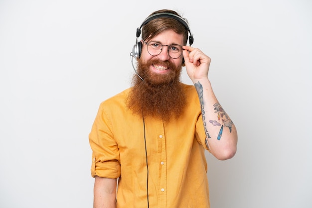 Telemarketer man isolated on white background with glasses and happy