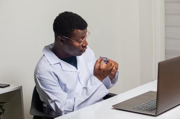 Telemedicine consultation during pandemic Doctor explaining on pulse oximeter usage