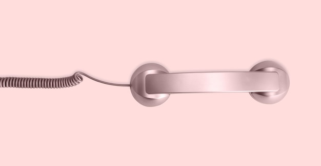 Telephone handset isolated on pink background Contact us banner Top view