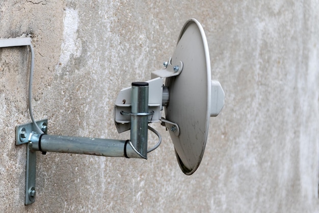 A television antenna on a concrete walll