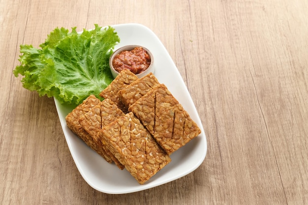 Tempeh, Tempe Goreng or Fried tempeh is Indonesia traditional food, made from fermented soybean seed