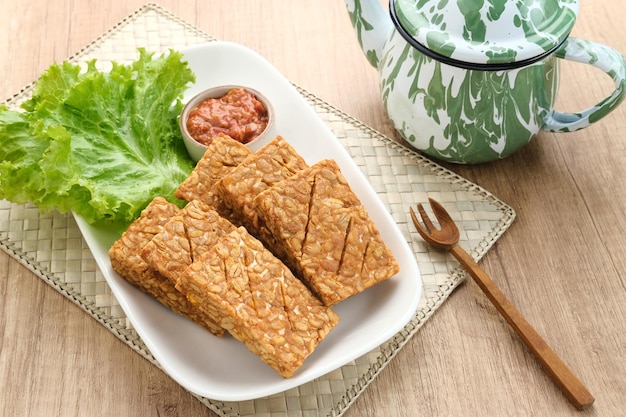 Tempeh, Tempe Goreng or Fried tempeh is Indonesia traditional food, made from fermented soybean seed