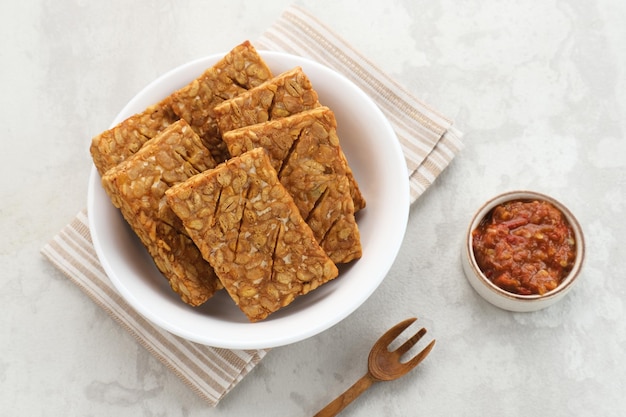 Tempeh, Tempe Goreng or Fried tempeh is Indonesia traditional food, made from fermented soybean seed