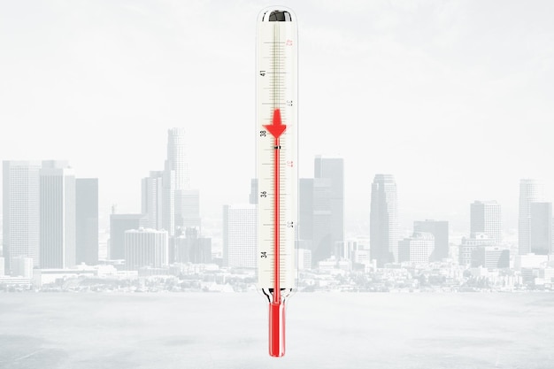 Photo the temperature falls with red arrow downward at city background