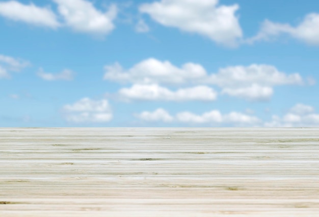 Template empty top table view with blue sky and cloud blur effect background