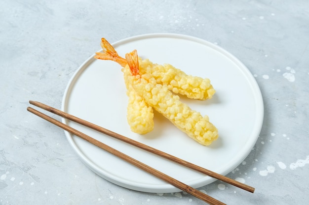 Tempura shrimp  on a white plate. Asian cuisine food delivery