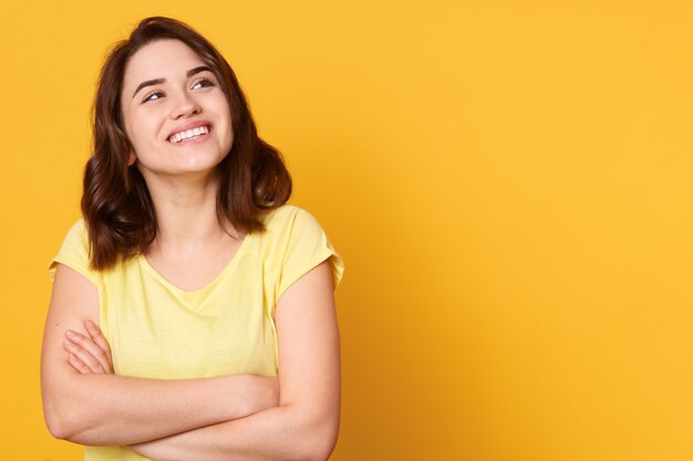 Tender charming happy woman has relaxed joyful face expression