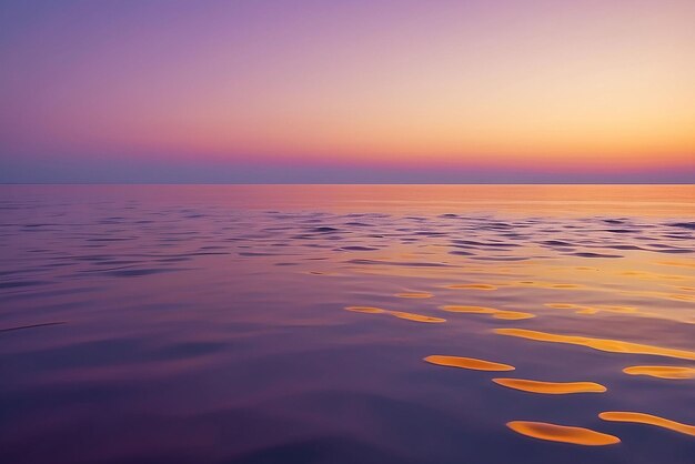 Photo tender orange and purple sky reflection on the sea surface calm sea water golden hour at the sea