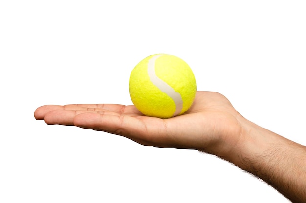 tennis ball held on palm isolated on white background