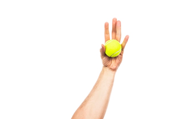 Tennis ball in male hand isolated on a white background