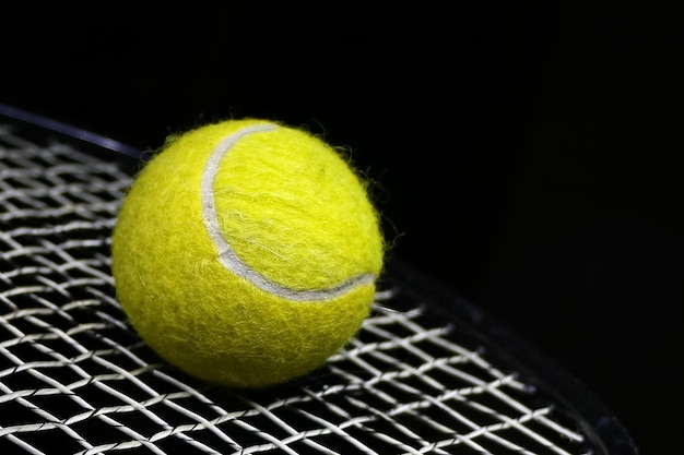 Tennis ball on the net