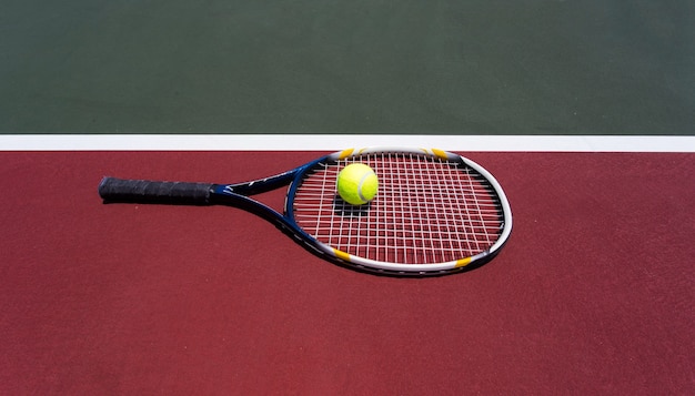 Tennis ball with racket on the tennis court.