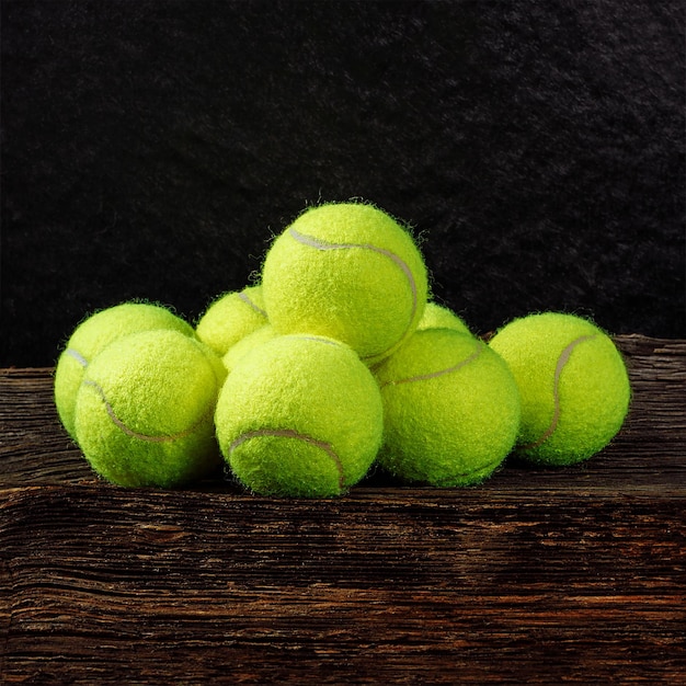 Tennis balls on wooden background sport concept rustic style stock photo