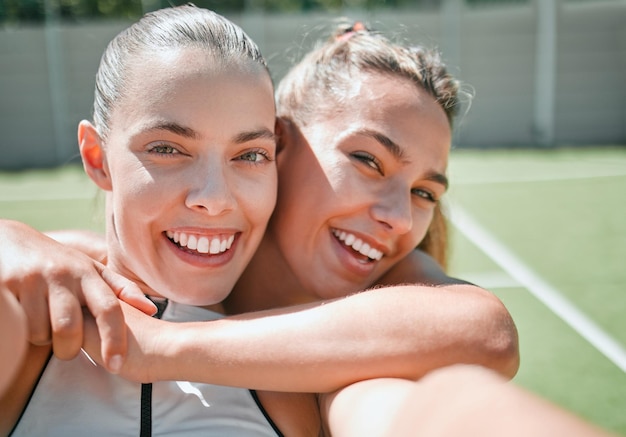 Tennis friends and sport selfie of women with a smile ready for a sports exercise and match Happy fitness and training athlete people at outdoor game feeling healthy from workout on a tennis court