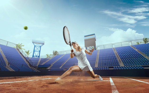 Tennis girl on a professional tennis court