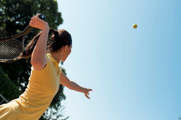 Tennis player with her racket