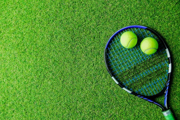 Tennis Racket and Balls on Grass Banner