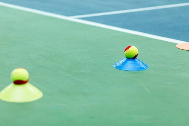 Tennis Training Cones and Balls on Court