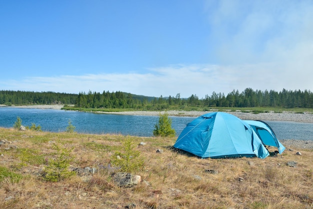 Tent tourist on the river Bank