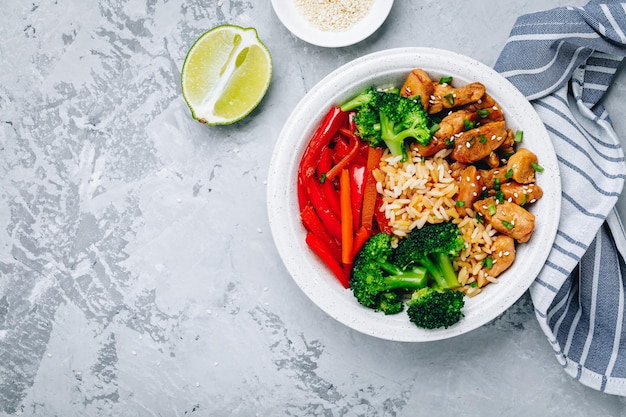 Teriyaki Chicken buddha bowl lunch with rice broccoli carrots and red bell pepper